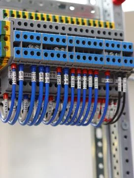 Connecting through-pass electrical terminals in the electrical panel Stock Photos