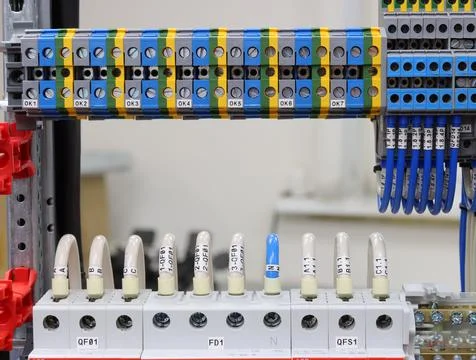 Connecting through-pass electrical terminals in the electrical panel Stock Photos