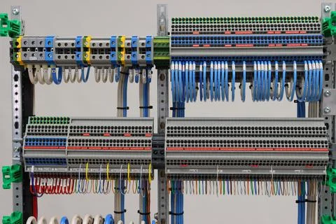 Connecting through-pass electrical terminals in the electrical panel Stock Photos