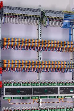 Connecting through-pass electrical terminals in the electrical panel Stock Photos