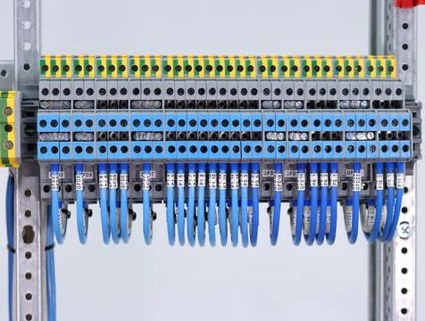 Connecting through-pass electrical terminals in the electrical panel Stock Photos