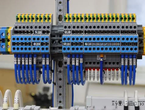 Connecting through-pass electrical terminals in the electrical panel Stock Photos