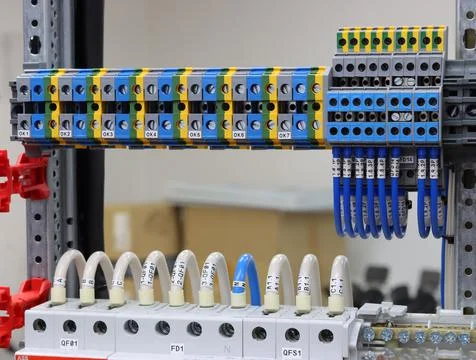 Connecting through-pass electrical terminals in the electrical panel Stock Photos