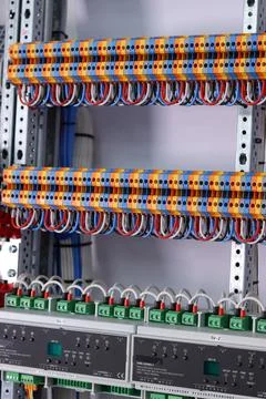 Connecting through-pass electrical terminals in the electrical panel Stock Photos