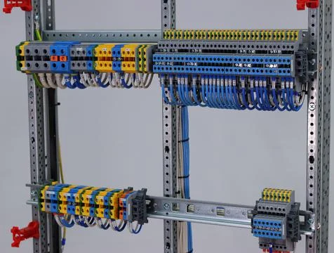 Connecting through-pass electrical terminals in the electrical panel Stock Photos