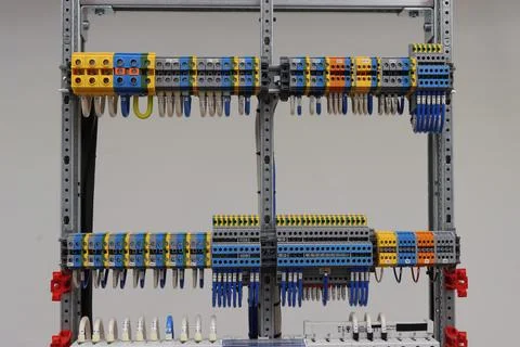 Connecting through-pass electrical terminals in the electrical panel Stock Photos
