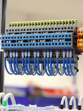 Connecting through-pass electrical terminals in the electrical panel Stock Photos