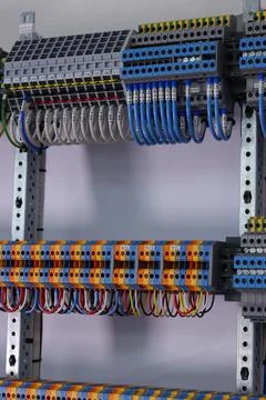 Connecting through-pass electrical terminals in the electrical panel Stock Photos