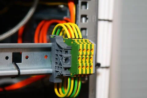 Connecting through-pass electrical terminals in the electrical panel Stock Photos