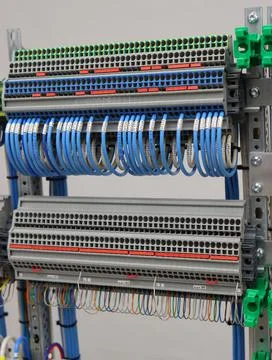Connecting through-pass electrical terminals in the electrical panel Stock Photos