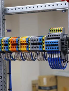 Connecting through-pass electrical terminals in the electrical panel Stock Photos