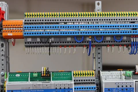 Connecting through-pass electrical terminals in the electrical panel Stock Photos