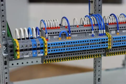 Connecting through-pass electrical terminals in the electrical panel Stock Photos