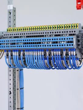 Connecting through-pass electrical terminals in the electrical panel Stock Photos