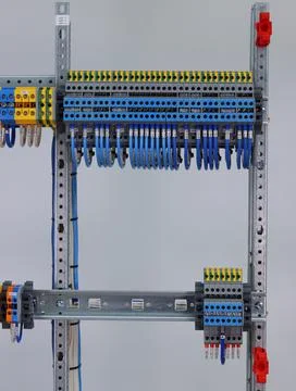 Connecting through-pass electrical terminals in the electrical panel Stock Photos