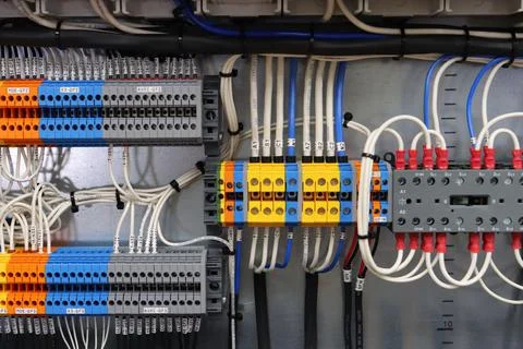 Connecting through-pass electrical terminals in the electrical panel Stock Photos