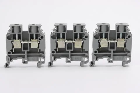 Connecting through-pass electrical terminals in the electrical panel Stock Photos