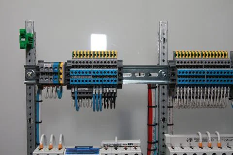 Connecting through-pass electrical terminals in the electrical panel Stock Photos