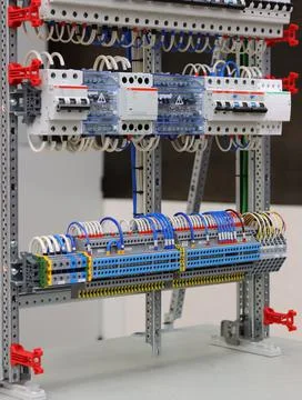 Connecting through-pass electrical terminals in the electrical panel Stock Photos