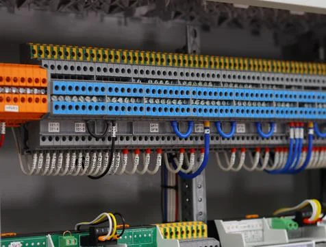 Connecting through-pass electrical terminals in the electrical panel Stock Photos