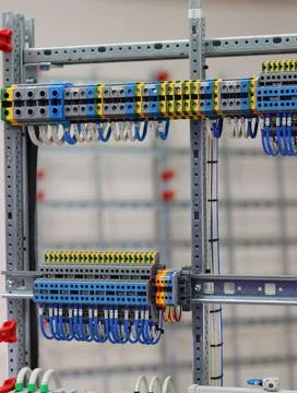 Connecting through-pass electrical terminals in the electrical panel Stock Photos
