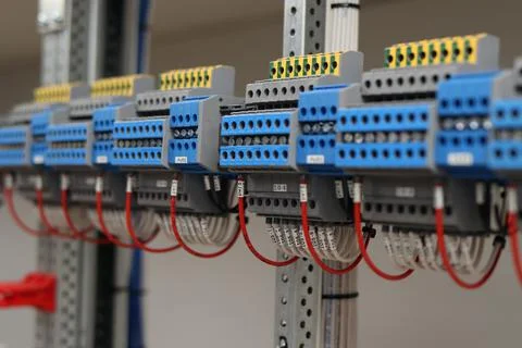 Connecting through-pass electrical terminals in the electrical panel Stock Photos