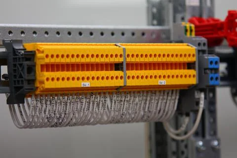 Connecting through-pass electrical terminals in the electrical panel Stock Photos
