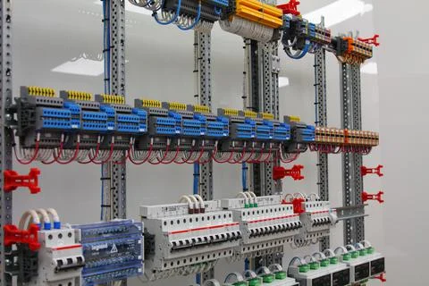 Connecting through-pass electrical terminals in the electrical panel Stock Photos