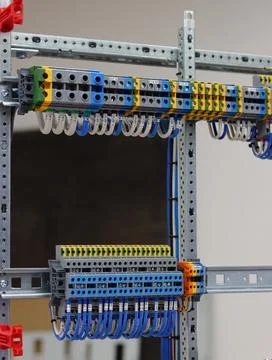 Connecting through-pass electrical terminals in the electrical panel Stock Photos