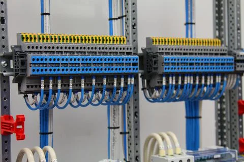 Connecting through-pass electrical terminals in the electrical panel Stock Photos