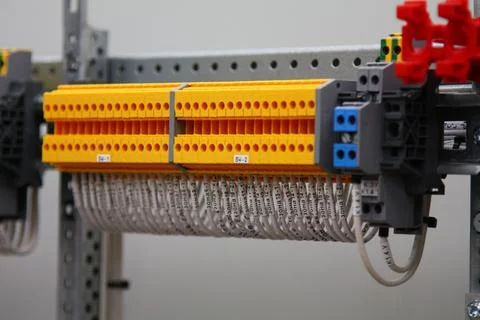 Connecting through-pass electrical terminals in the electrical panel Stock Photos
