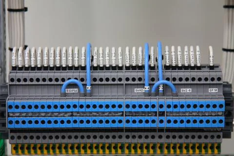 Connecting through-pass electrical terminals in the electrical panel Stock Photos