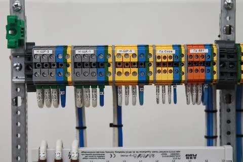 Connecting through-pass electrical terminals in the electrical panel Stock Photos