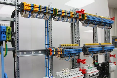 Connecting through-pass electrical terminals in the electrical panel Stock Photos