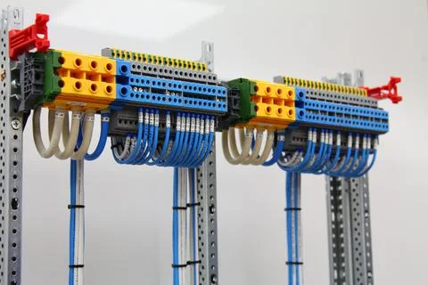 Connecting through-pass electrical terminals in the electrical panel Stock Photos