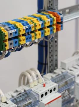 Connecting through-pass electrical terminals in the electrical panel Stock Photos