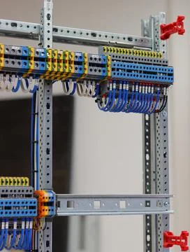 Connecting through-pass electrical terminals in the electrical panel Stock Photos