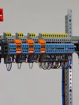 Connecting through-pass electrical terminals in the electrical panel Stock Photos