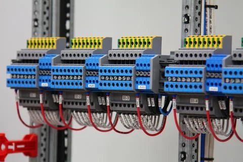 Connecting through-pass electrical terminals in the electrical panel Stock Photos