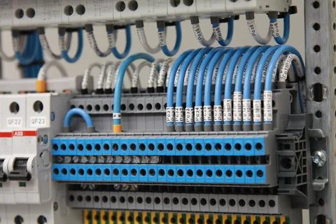 Connecting through-pass electrical terminals in the electrical panel Stock Photos