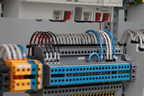 Connecting through-pass electrical terminals in the electrical panel Stock Photos