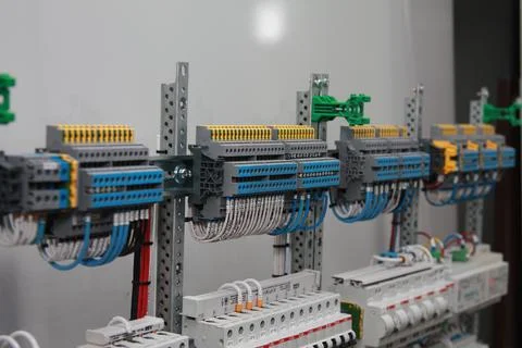 Connecting through-pass electrical terminals in the electrical panel Stock Photos