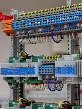 Connecting through-pass electrical terminals in the electrical panel Stock Photos
