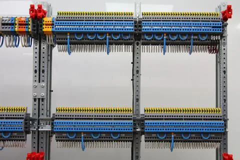 Connecting through-pass electrical terminals in the electrical panel Stock Photos