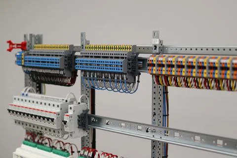 Connecting through-pass electrical terminals in the electrical panel Stock Photos