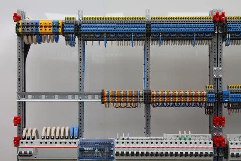 Connecting through-pass electrical terminals in the electrical panel Stock Photos