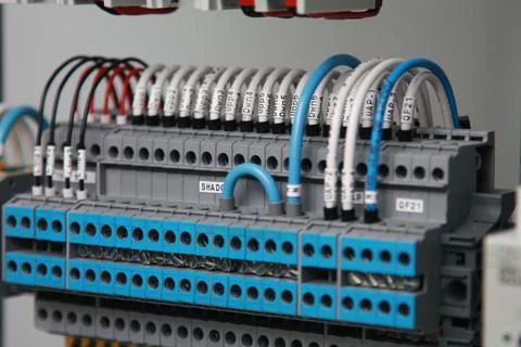 Connecting through-pass electrical terminals in the electrical panel Stock Photos