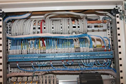 Connecting through-pass electrical terminals in the electrical panel Stock Photos