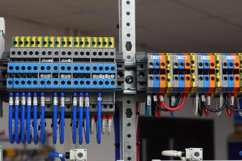 Connecting through-pass electrical terminals in the electrical panel Stock Photos
