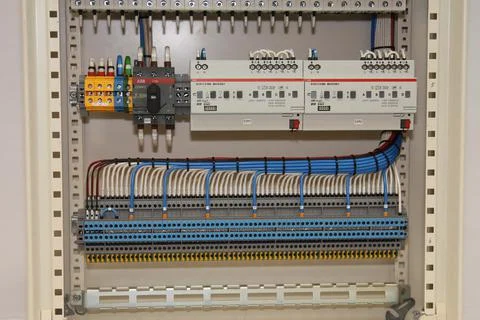 Connecting through-pass electrical terminals in the electrical panel Stock Photos